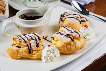 Eclairs with dark chocolate