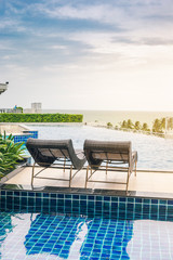 pool bed near swimming pool in tropical resort, thailand.