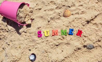 Fototapeta na wymiar Word summer from multicolored wooden letters