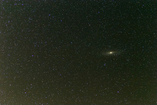 night starry sky with andromeda galaxy