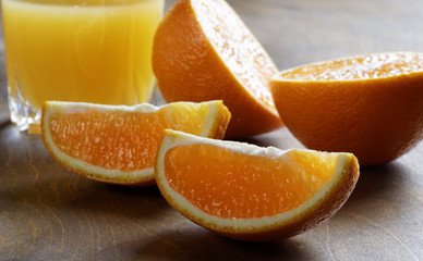 sliced oranges and glass of juice on the table