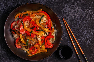 Cooking asian stir fry noodles with vegetables