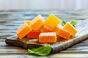 Homemade marmalade on a wooden stand.