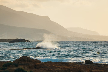 Obraz premium Landscape of beautiful coast during sunset near Malia, Crete, Greece