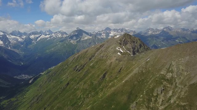 Summer mountains of North Caucasus, Dombay region, Karachay-Cherkessia. Bird's eye view, quadrocopter, 4K