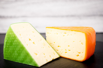 Different types of cheeses  on wooden  background with copy space