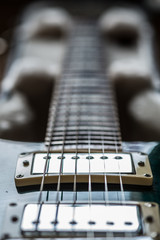 Fototapeta na wymiar Electric guitar pickups and neck close up view