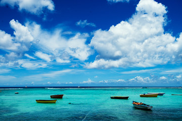 Exotic sea with a group of empty boats.