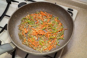 Chopped vegetables on frying pan healthy food