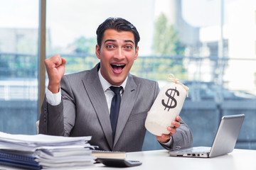 Businessman with money sack bag in office