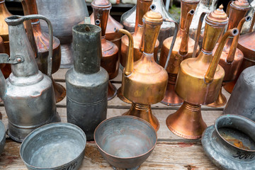 Antique brass jugs and dishes