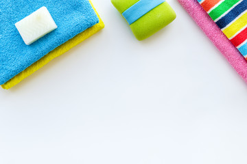 Bathroom set. Towels and soap on white backgrond top view copyspace