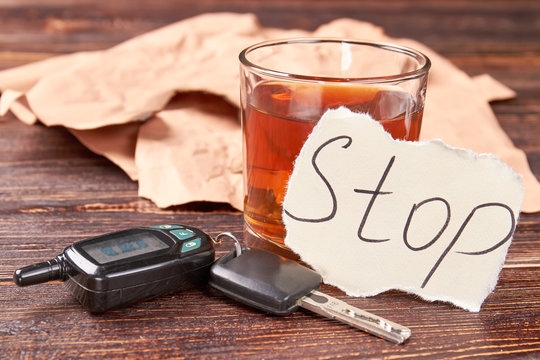 Car keys and alcohol. Stop drink alcohol beverage concept.