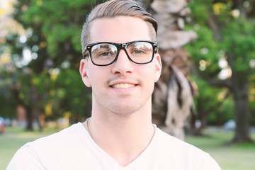 Man with glasses at the park.