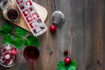 Ice cranberry morse on wooden table top view copyspace © 9dreamstudio