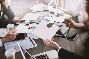 Teamwork of partners. Concept of integration and startup with puzzle pieces