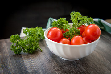 Vintage cherry tomatoes on a wooden table