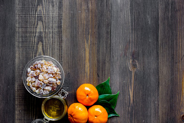 Preparing light summer dessert. Oranges, honey, sugar on wooden table background top view copyspace