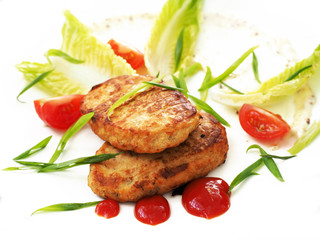 Cutlets with ketchup, mustard sauce, lettuce, green onions and tomatoes isolated on white background. Two fried cutlets