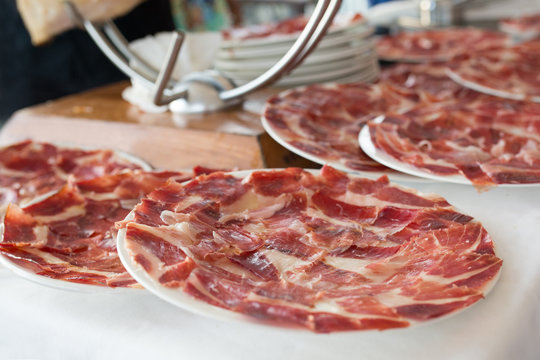 Sliced "jamon iberico de pata negra" traditional spanish cured ham
