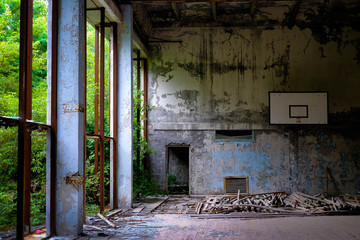 Fototapeta na wymiar Abandoned basketball field in Pripyat, close to Chernobyl in Ukraine