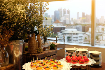 Desserts served as snack during coffee break time with flowers decoration.