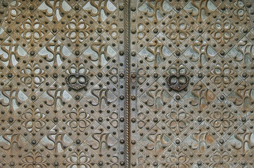 Old metal door with decorative elements