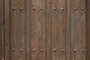 Old wooden door with metal elements