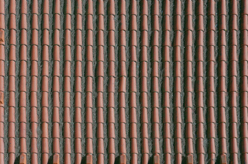 Old red tile roof background texture close up