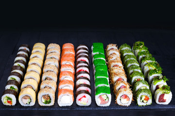 Sushi rolls assortment, delicious appetizing japanese food