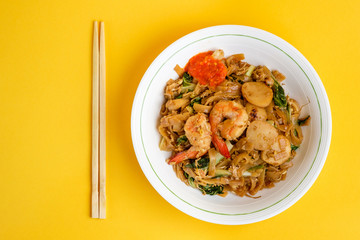 Stir fried flat rice noodle or char kway teow that is famous among Indonesian, Malaysian and Singaporean as breakfast or another meal