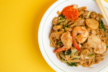 Stir fried flat rice noodle or char kway teow that is famous among Indonesian, Malaysian and Singaporean as breakfast or another meal