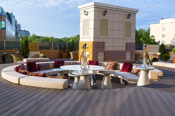 Interior of the restaurant on the terrace in the open air. Restaurant on the terrace. Classic interiors of a luxury restaurant