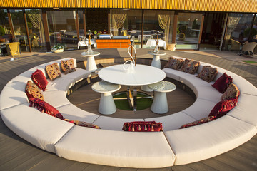 Interior of the restaurant on the terrace in the open air. Restaurant on the terrace. Classic interiors of a luxury restaurant