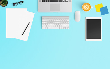 Modern workspace with coffee cup, notebook, smartphone and laptop copy space on Blue color background. Top view. Flat lay style.