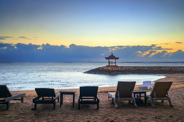 Stunning beautiful morning beach. Famous travel destination in Sanur, Bali, Indonesia.