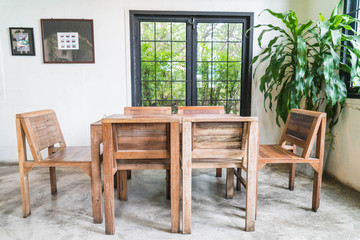 empty wood table in dinning room - obrazy, fototapety, plakaty