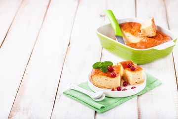Cottage cheese casserole on a light background. Selective focus. Copy space