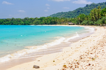 Sandy beach and turquoise water in the bay at Port Olry - Espiritu Santo, Vanuatu
