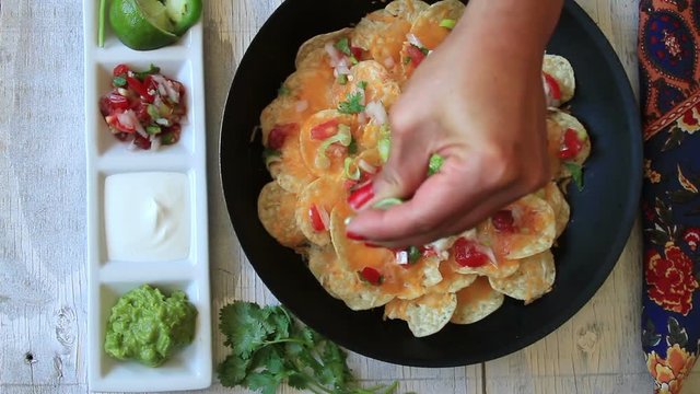 Nachos Severed in a hot skillet and finished with squeezed lime juice.