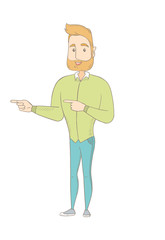 Young caucasian hippie man pointing to the side.