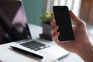 Man hand holding smartphone