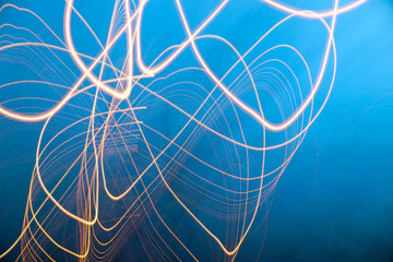 Long exposure light drawing photograph with interesting, abstract  shape.