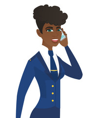Young african stewardess talking on a mobile phone