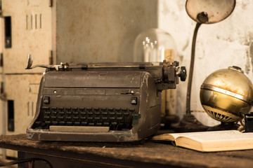 Typewriter and old books on the desk