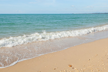 Wave of the sea on the sand beach