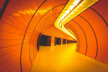 Empty orange futuristic subway tunnel