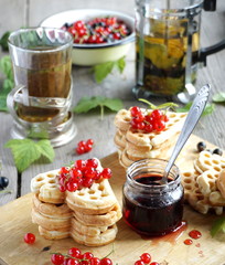 Waffles with red currants and jam