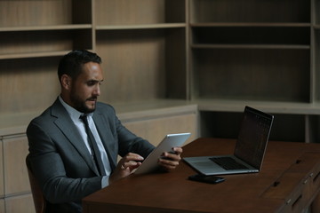 Businessman ipad laptop 1