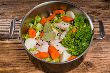 Metal stock pot with soup ingredients